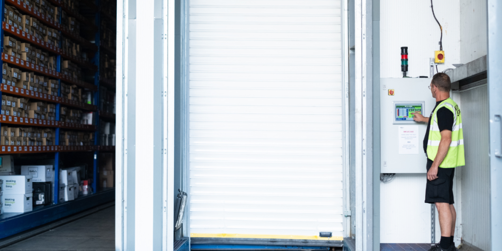 Picture of a document storage worker closing a document storage vault